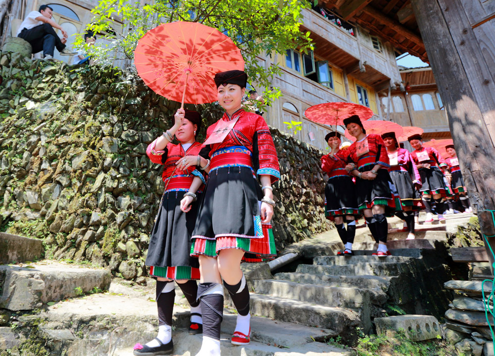 Yao girls wear red clothes in Dazhai Village