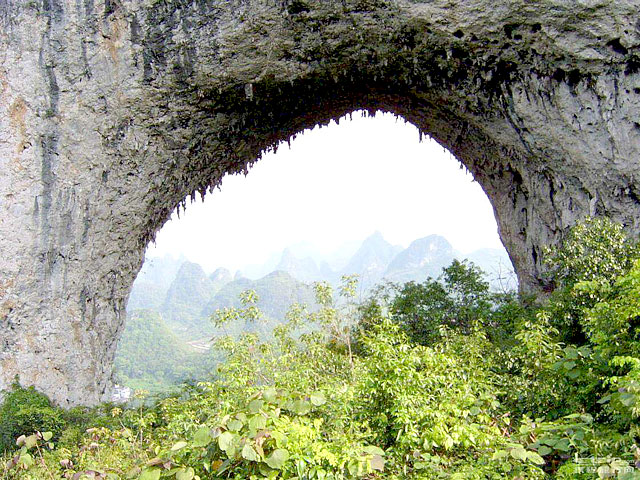 Moon Hill is top attraction in Yangshuo, can be reached by biking