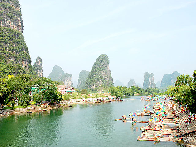 Leisurely bamboo rafting along Yangshuo Yulong River